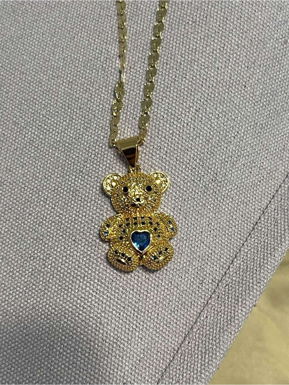 Gold Teddy Bear Pendant Necklace with Blue Heart Accent